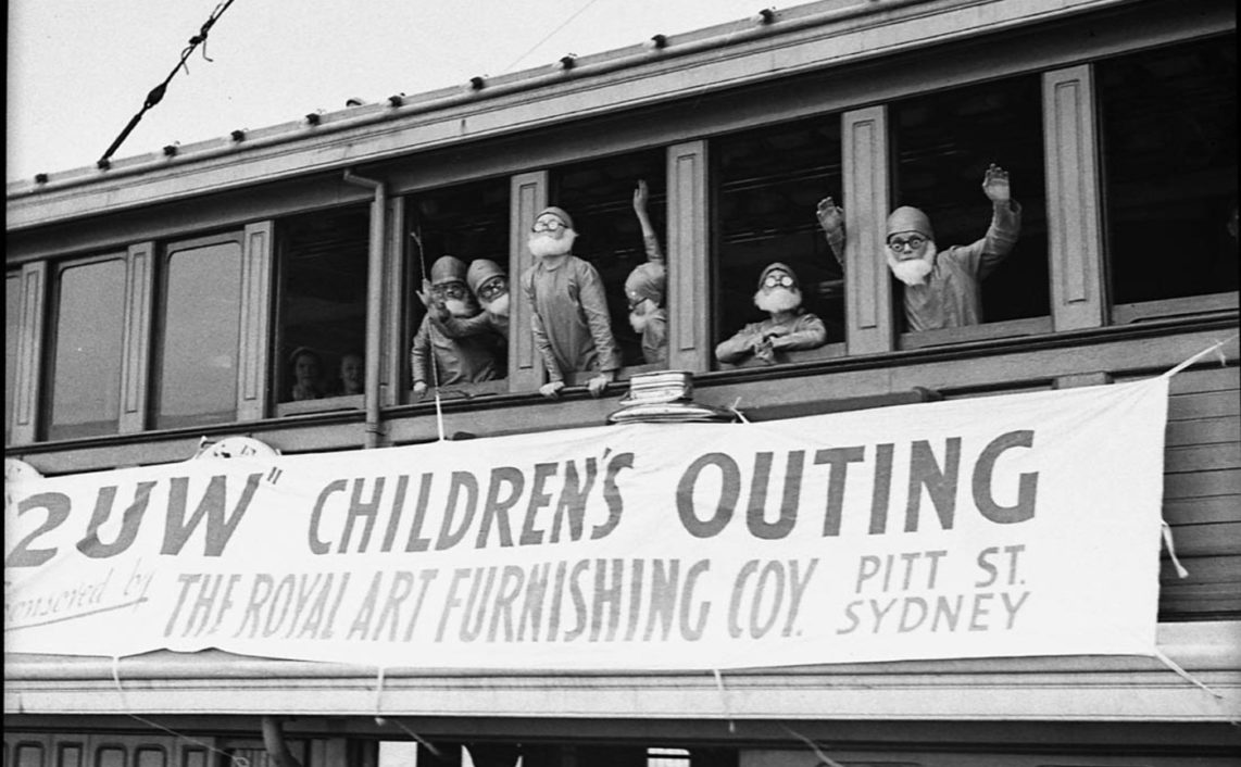 Gnomes looking out window of Kuttabul Ferry, during 2UW Harbour Cruise, 1937